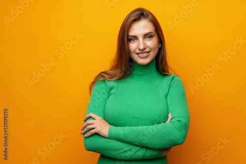 Pretty young woman smiling over yellow isolated background