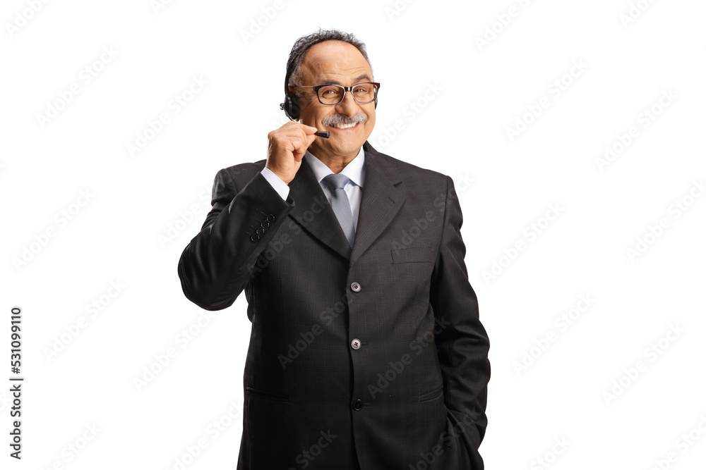 Smiling mature dispatcher in a suit posing and looking at camera Smiling mature dispatcher in a suit posing and looking at camera