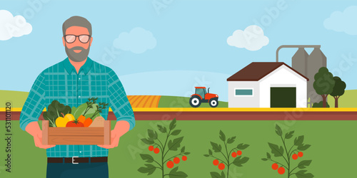 Senior farmer holding a crate with fresh produce and farm