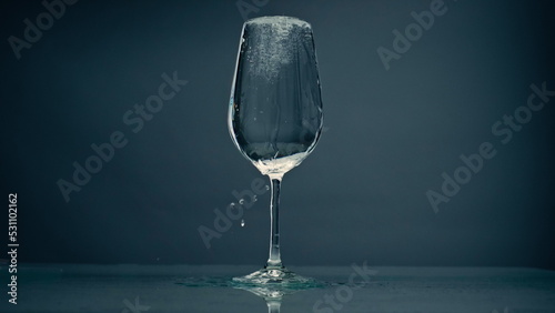 Принти на полотні Pure water overflowing glass closeup