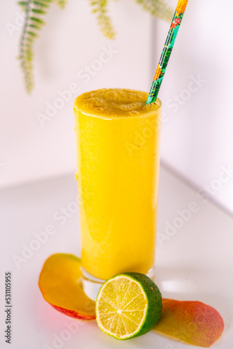glass of mango juice with lime