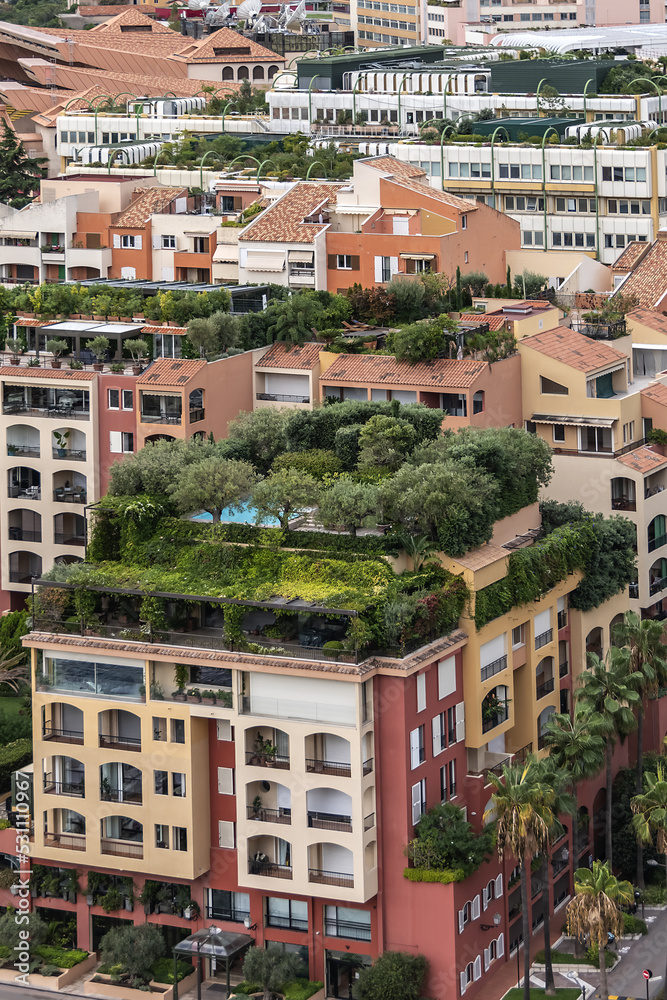 Panoramic view of Fontvieille - district of Monaco with boats and a high-rise apartment complex. Principality of Monaco, French Riviera, Western Europe.