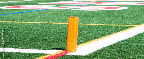 Orange pylon marking the end zone for a football game photo