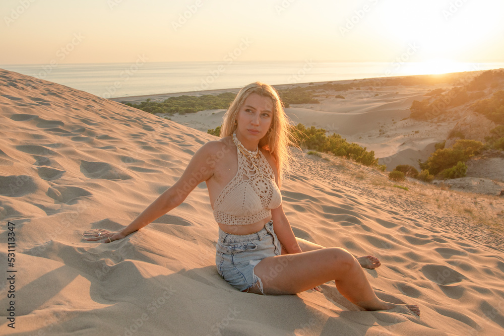 Happy traveler woman joy relaxing on summer vacation at sunset