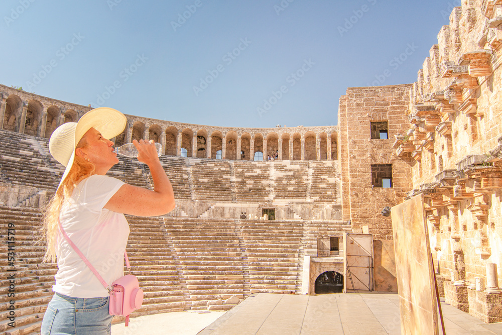 Woman tourist  visiting The Theatre of Aspendos Ancient City in Antalya