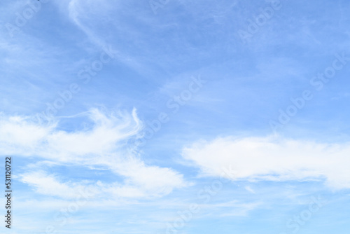 White clouds in a bright blue sky. The beauty of the nature