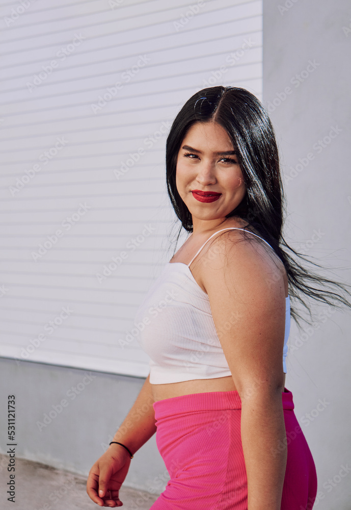 Stylish plus size woman walking on street Stylish plus size woman walking on street