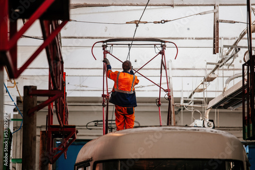 Tram in service depot. Maintenance and repairing of pantograph
