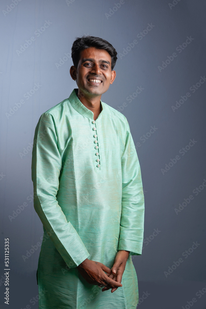 Indian man in tradition wear and giving expression Indian man in tradition wear and giving expression