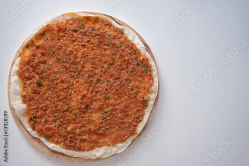Lahmacun, the popular food of traditional Turkish cuisine. Top view of lahmacun isolated on white background. photo