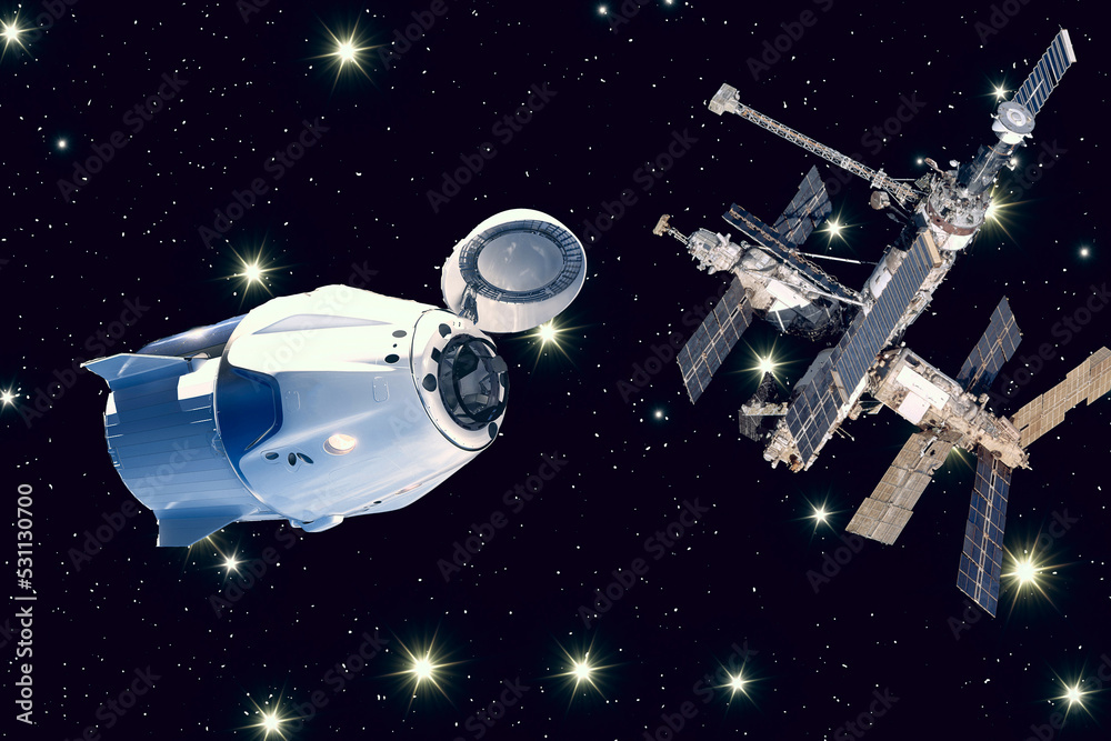 Spaceship and a Space station on the orbit.The elements of this image furnished by NASA. Spaceship and a Space station on the orbit.The elements of this image furnished by NASA.