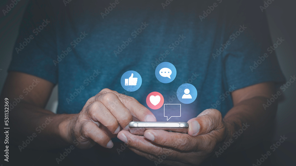 Man using mobile phone to communicate via internet network, concepts, social media, long distance phone, long distance video call, digital online, social distancing and working from home. Man using mobile phone to communicate via internet network, concepts, social media, long distance phone, long distance video call, digital online, social distancing and working from home.