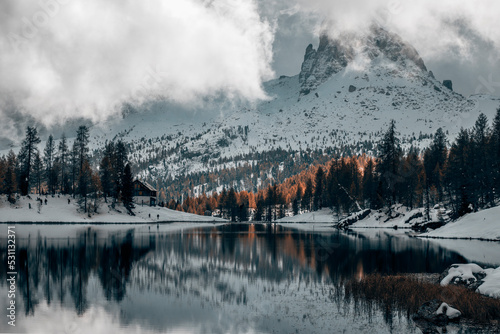 morning by the lake in the late autumn snow covered mountains in italian alps © Francesca Emer