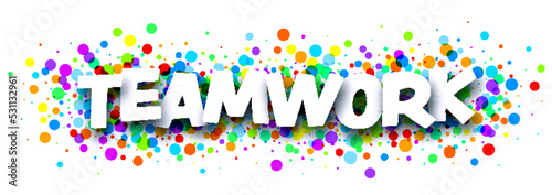 Teamwork sign over colorful cut ribbon confetti background.