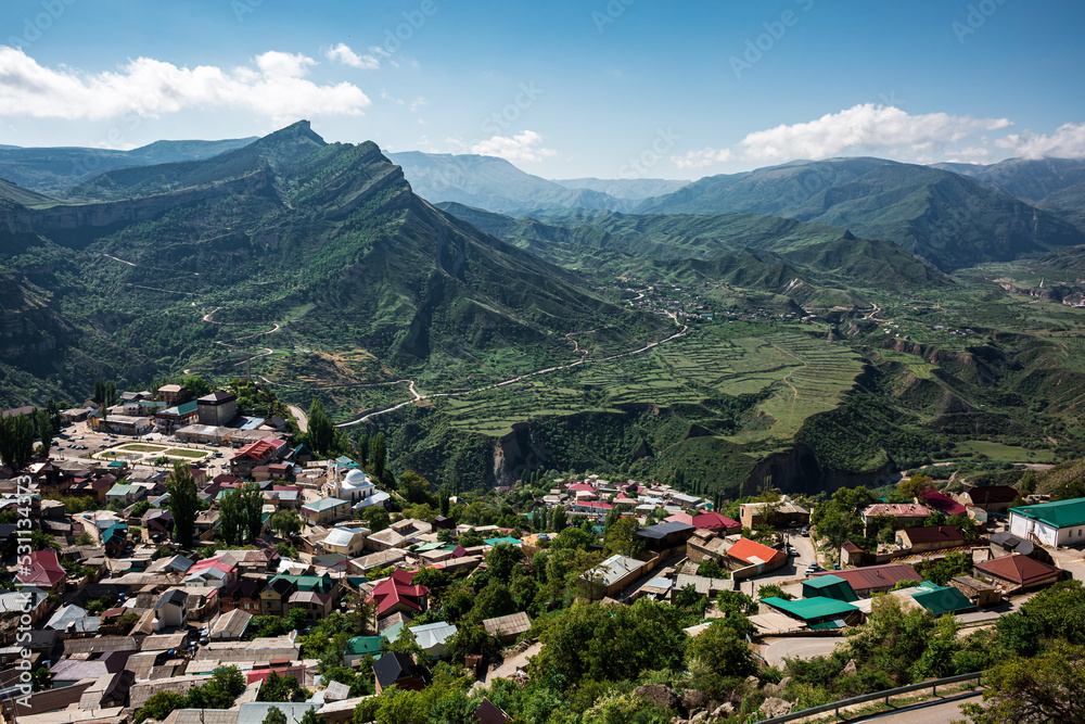 Gorol Gunib, high in the mountains, against the backdrop of green mountains, many houses against the backdrop of mountains.