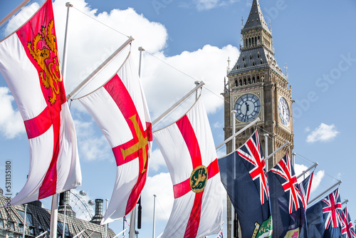 London, UK.  Big Ben, British and commonwealth countries flags during the funeral ceremony of Queen Elizabeth II photo