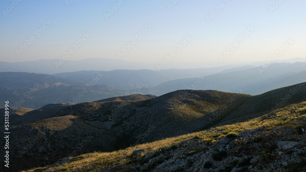 Panoramic view of Nemrut Mount and Taurus Mountains. Sunrise above Nemrut National park. UNESCO World Heritage Site. Adiyaman province, Turkey 