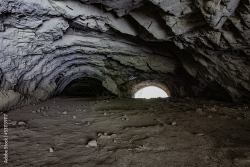 Dark dirty collapsed road tunnel photo