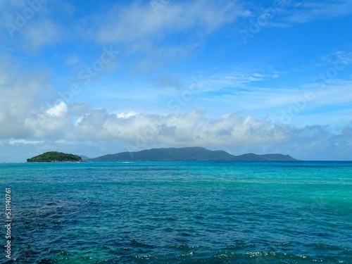 Seychelles, view of Round Island and La Digue Island from the Baie Sainte Anne pier on Praslin Island