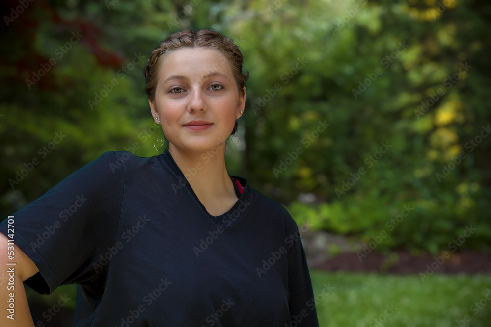 young woman portrait in a park wearing black beautiful friendly brunette student young woman portrait in a park wearing black beautiful friendly brunette student