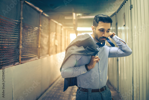 Photography Portrait of young business man hurrying through the passage