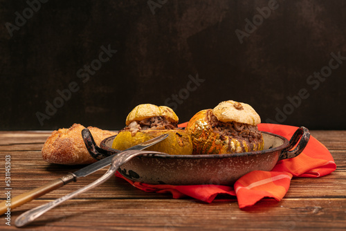 Giraumon or turbaned pumpkin stuffed with meat in an old dish photo