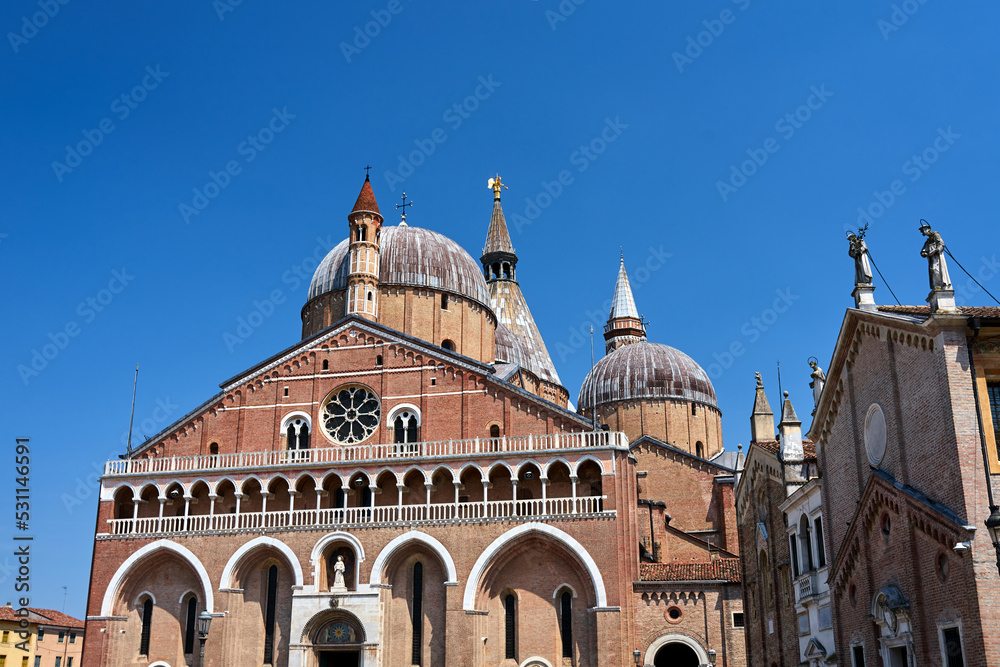 The facade, domes and towers of the medieval church of St. Anthony in the city of Padua