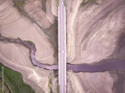 Bridge over Reservoir with very low water, photo taken from a drone