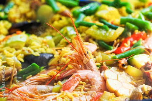 Traditional spanish rice paella with seafood  shrimp close-up 