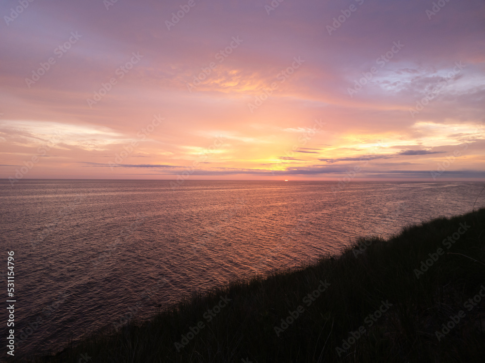 View of a Lake Michigan sunset on a cloudy day from Muskegon State Park in Western Michigan