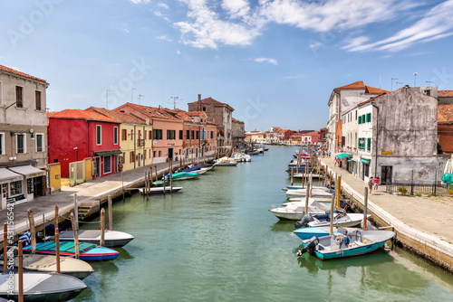 Murano, Italy - July 7, 2022: Scenery along the canals in Murano Italy  © Torval Mork