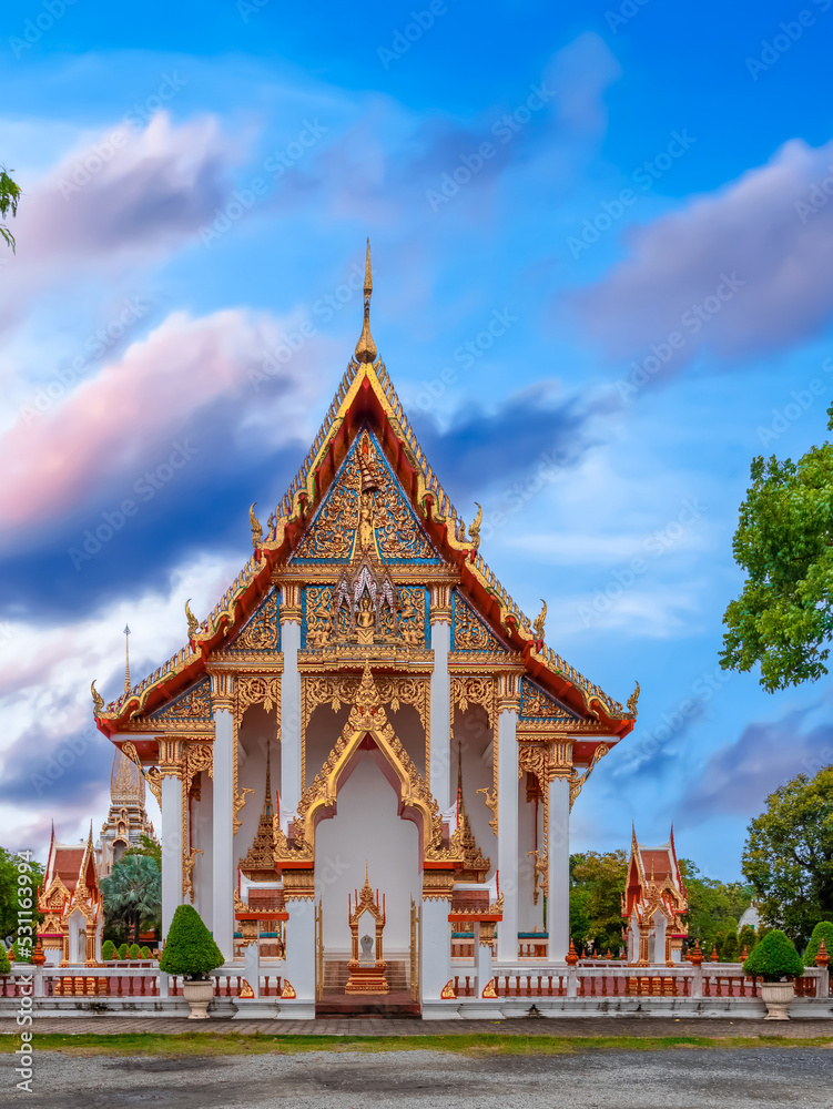 Wat Chalong Buddhist temples in Phuket Thailand. Decorated in beautiful ornate colours of red and Gold and Blue. Lovely sunset. Wat Chaithararam