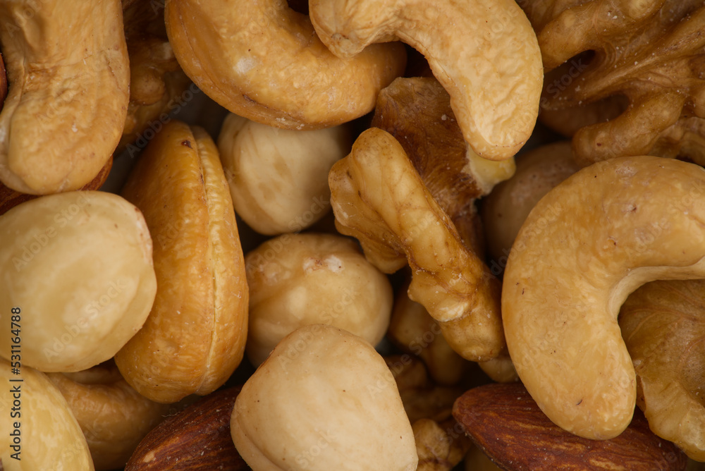 Fototapeta premium Nuts of different types of closeup. View from above