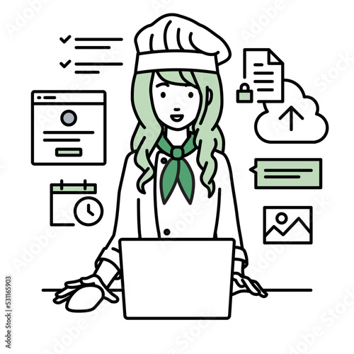 デスクで座ってPCでネットショップやマーケティングの仕事をしている調理師の女性