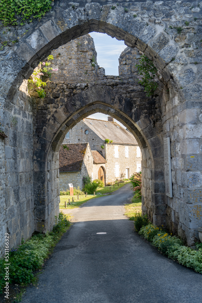 View of double arch Gothic medieval city gate at Yevre le chatel castle in France