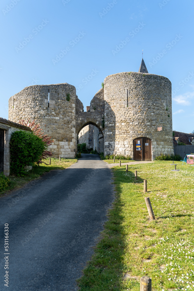 View of Yevre le Chatel medieval fortified gate with two round towers protecting the strategically important town