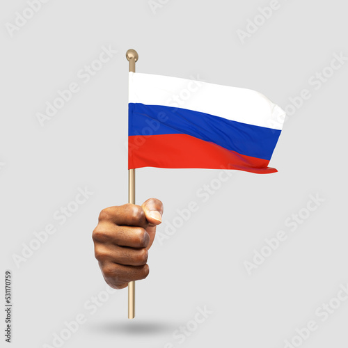 Hand holding Russian national flag isolated on gray background
