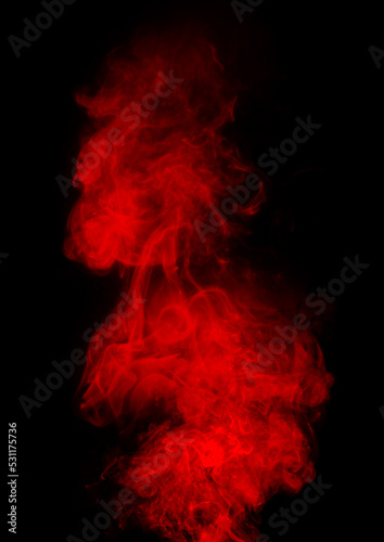 Red smoke in in black background powder color splash 