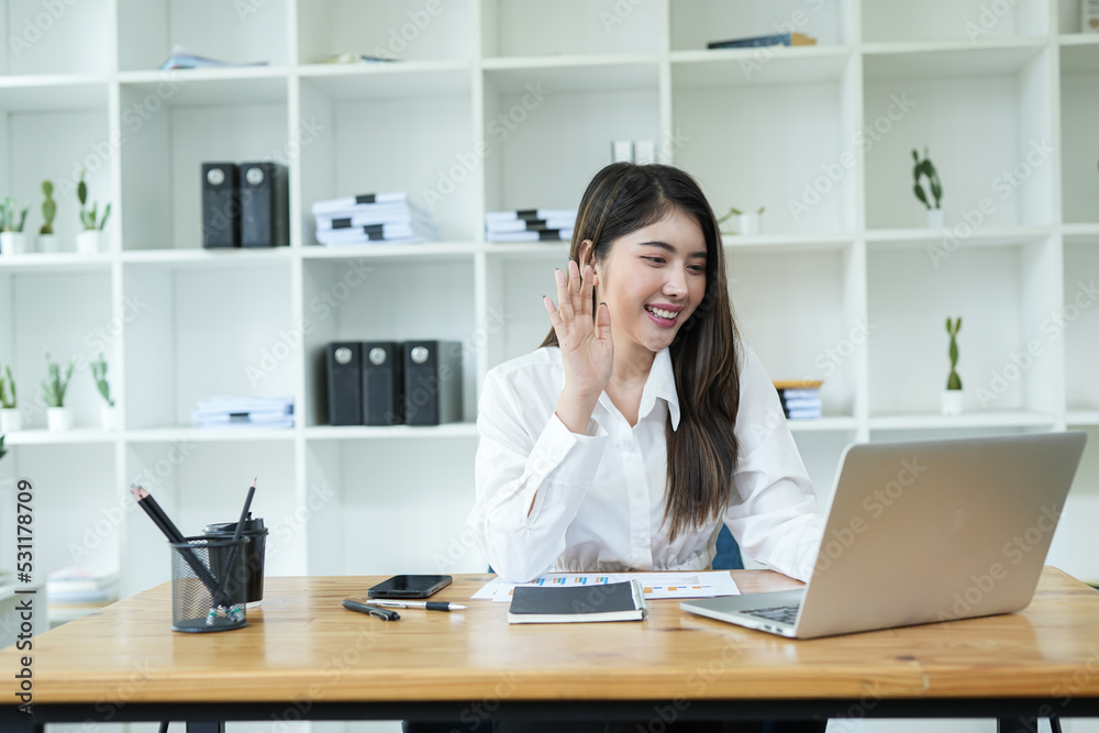 Asian business woman Use a laptop computer and work at the office ready. plan to analyze financial reports Asian business woman Use a laptop computer and work at the office ready. plan to analyze financial reports