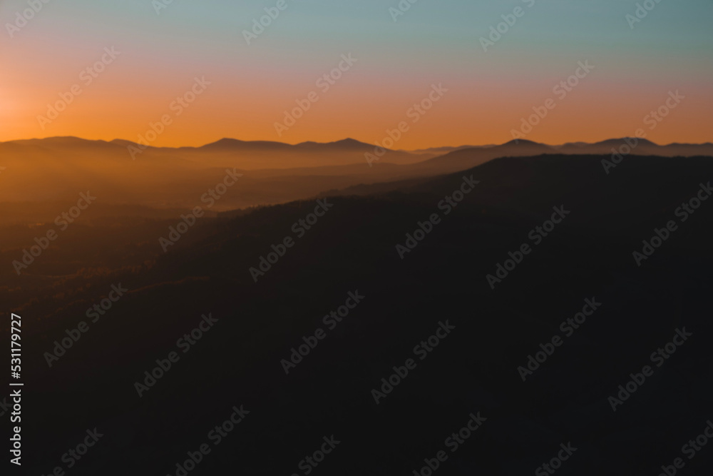 Beautiful mountains view in the morning. Sunrise autumn foggy landscape