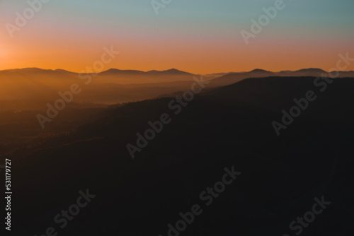 Beautiful mountains view in the morning. Sunrise autumn foggy landscape