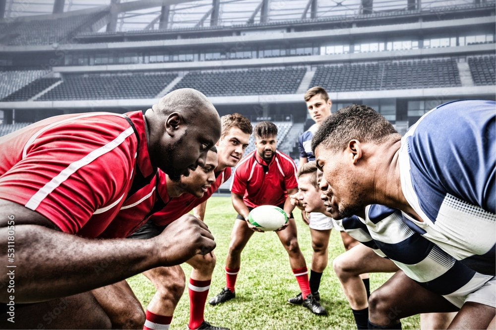 Φωτογραφία Digital composite image of team of rugby players facing each other in sports sta