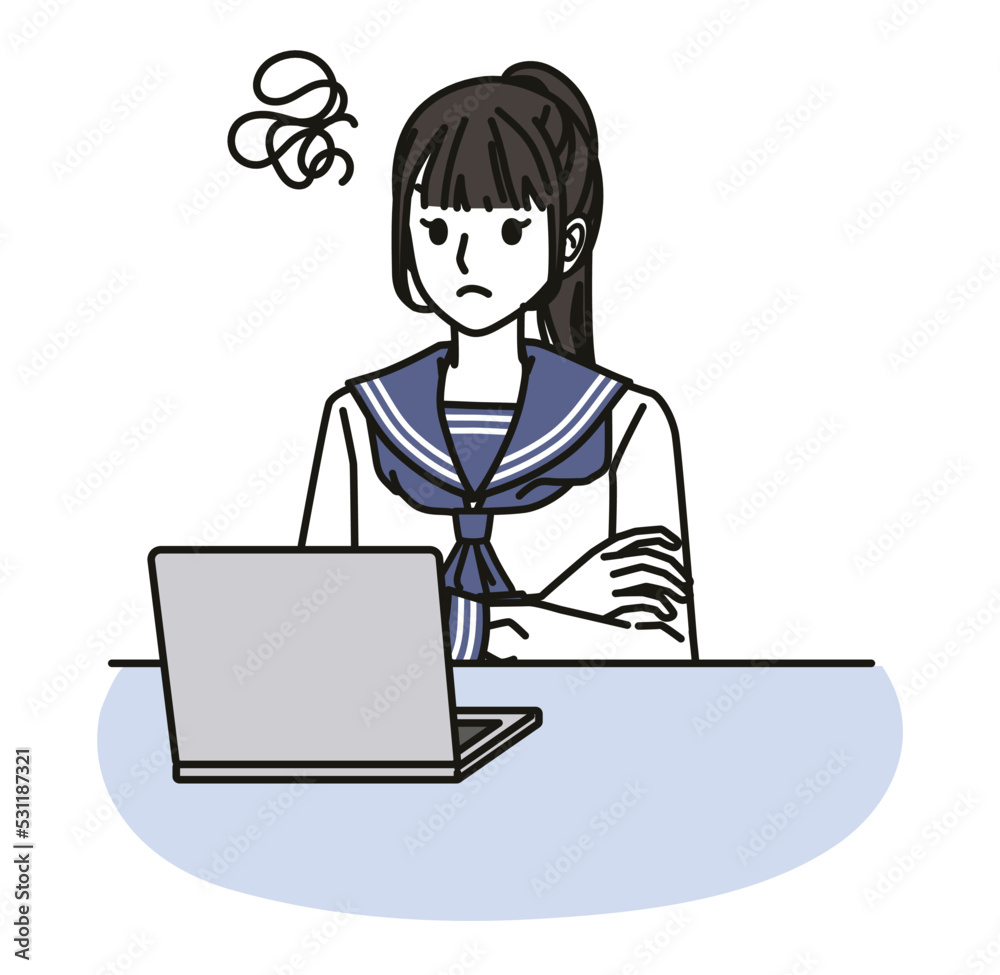パソコンの画面を見てイライラする女子中学生・高校生 パソコンの画面を見てイライラする女子中学生・高校生