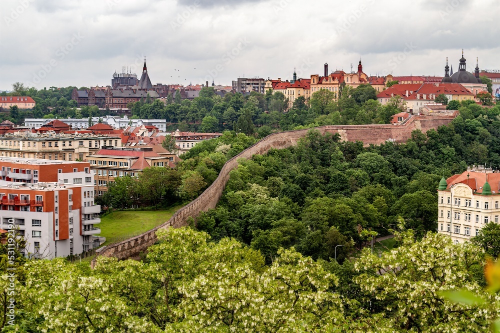 View of Prague along the Vltava River in Prague, Czech Republic, viewed from the Vysehrad fort on a cloudy day. - stock photo View of Prague along the Vltava River in Prague, Czech Republic, viewed from the Vysehrad fort on a cloudy day. - stock photo