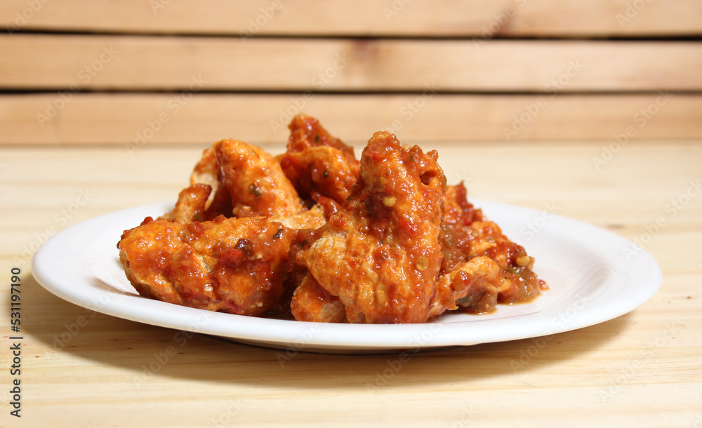 Fried Pork Skins With Red Salsa in Rustic Kitchen