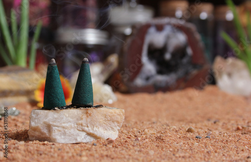 Fototapeta Naklejka Na Ścianę i Meble -  Chakra Stones With Aloe Vera and Incense Cones on Australian Red Sand