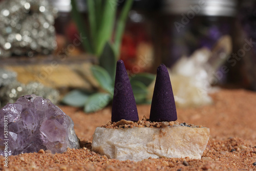 Amethyst Crystals and Chakra Stones on Australian Red Sand. Meditation Table