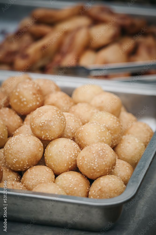 Trays of glutinous rice sesame balls called Trays of glutinous rice sesame balls called