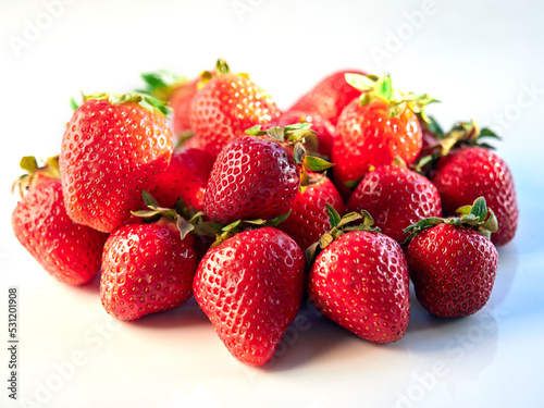 Fresh  red and delicious strawberries  on a white background