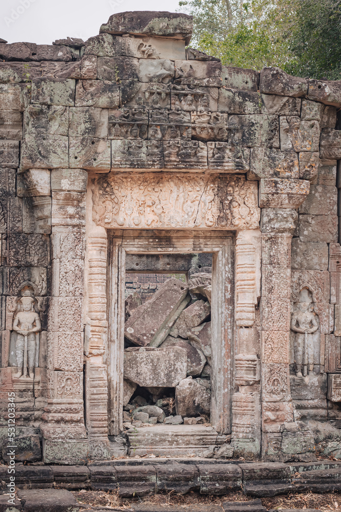 Siem Reap, Cambodia - March 19th, 2020 : door of a ruin temple at Angkor Wat archeological complex